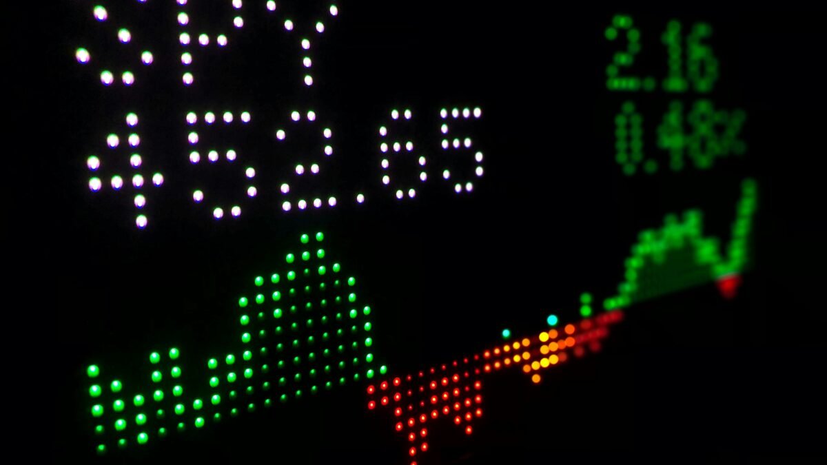 Stock market trading screens illustrating S&P 500 and Nasdaq record highs